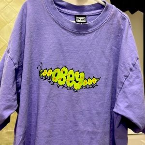 Purple Obey tee great for parties and streetwear. It is an S in men’s.